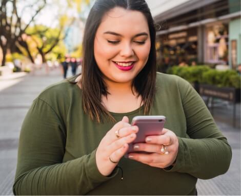 young-plus-size-woman-using-her-mobile-phone-2024-10-17-00-46-11-utc (1)