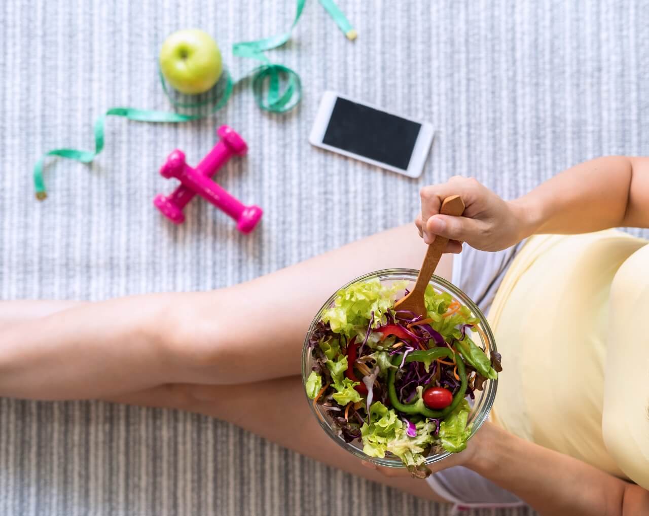 young-woman-eating-homemade-healthy-salad-at-home-2023-11-27-04-51-57-utc (1)