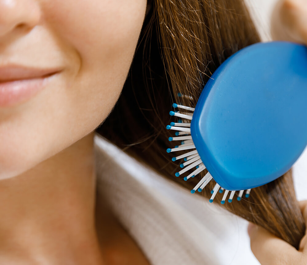 closeup-of-female-hair-with-hair-brush-2024-10-15-08-29-40-utc (1)