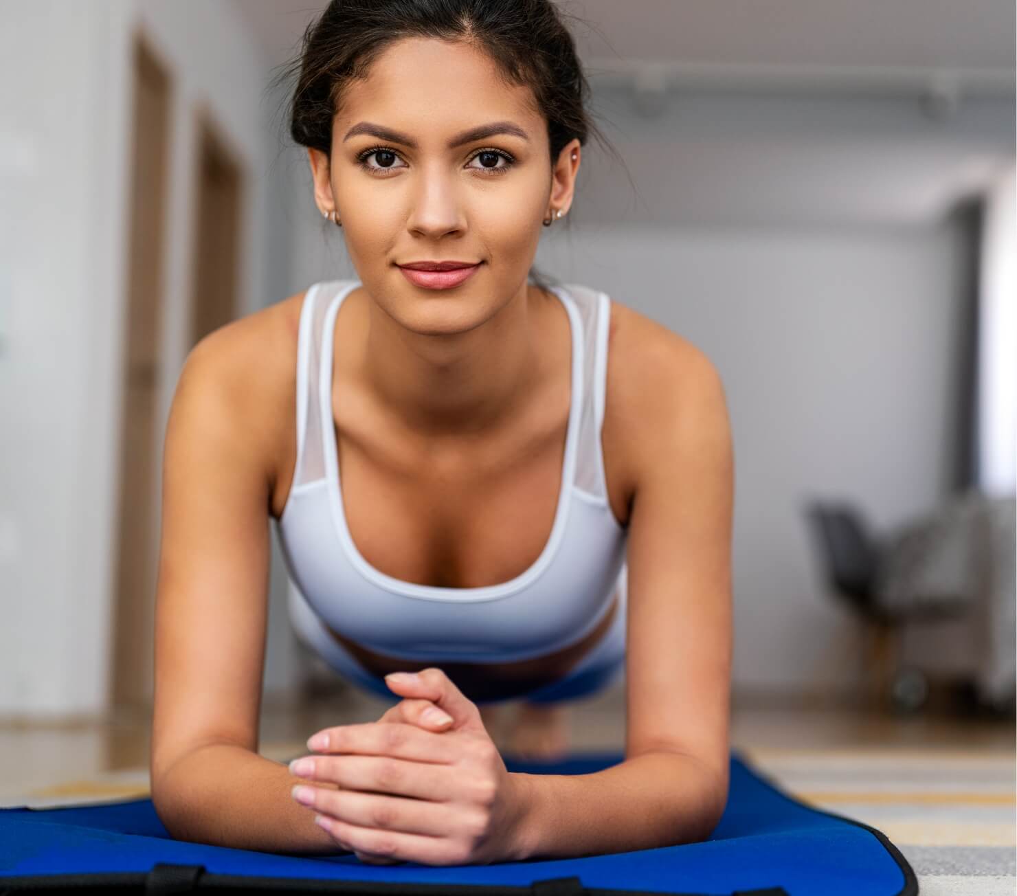 happy-fit-young-woman-exercising-at-home-healthy-2023-11-27-05-04-55-utc (1)