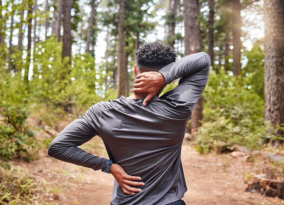 man-holding-his-neck-and-back-in-pain-while-out-fo-2025-04-06-07-48-06-utc (1)