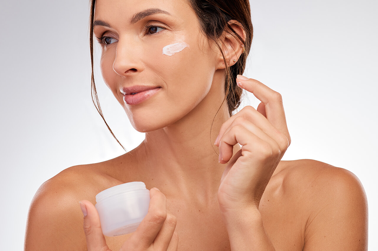shot-of-an-attractive-young-woman-applying-moistur-2025-04-06-07-45-20-utc (1)