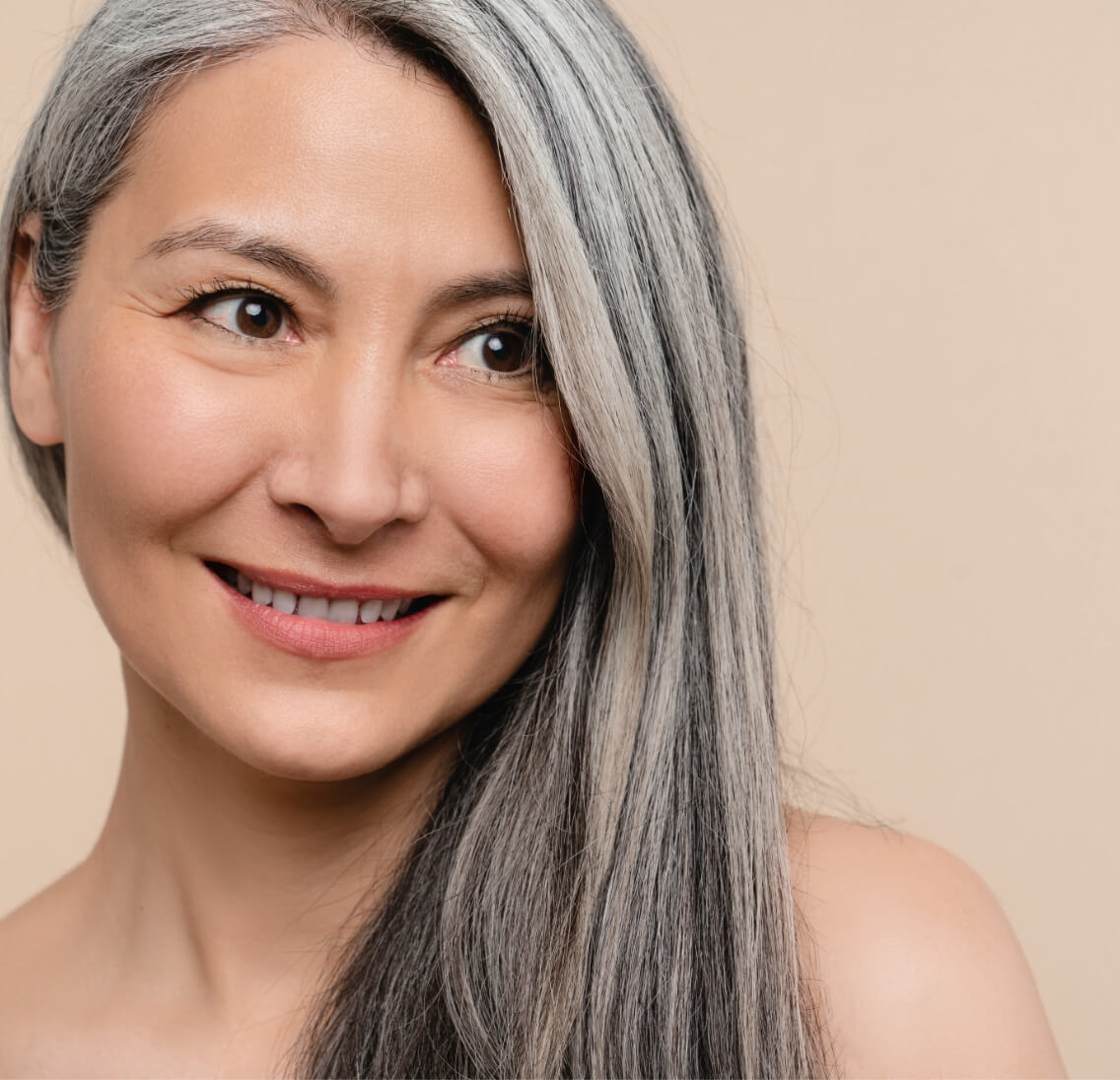 woman-with-long-grey-hair-hair-care-and-treatment-2023-11-27-04-56-03-utc (1)